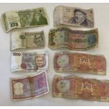 A collection of 8 vintage foreign bank notes from India, Israel, Ireland and Italy.