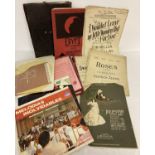 A collection of assorted vintage records and sheet music.