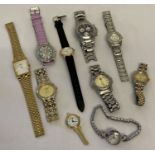 A tub of mixed men's and ladies wrist watches in varying styles and conditions.