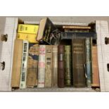 A box of assorted vintage and antique books to include leather bound editions.