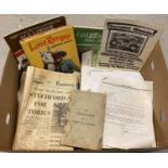 A box of assorted vintage ephemera and books.