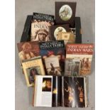 A box of assorted books relating to Native Americans.