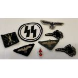 A small collection of German WWII style embroidered cloth badges.