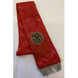 A German WWII style red satin sash with bullion detail and tassels.