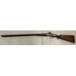 An Antique double barrelled 16 bore percussion shotgun, with rod and wad removal screw.