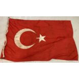 A large WWI style Ottoman Empire Turkish Flag, with rope and wooden toggle.