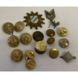 A collection of military buttons and badges.