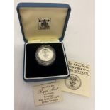 A silver proof 1985 £1 coin in presentation case and protective cover.