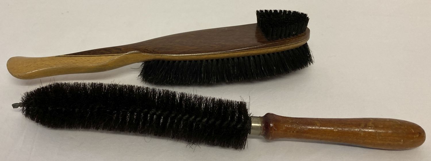 2 vintage wooden handled uniform brushes, one stamped "Rooney 1943" to handle.