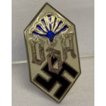 A German WWII style Workers Association, pin back lapel badge with enamelled detail.