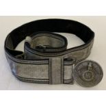 A reproduction German SS officers silver brocade belt and circular buckle.