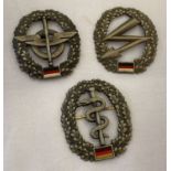 3 modern BRD German army beret badges. Logistics QM troops, Medical troops and Signal Corps.
