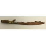 A WWI style Trench Art letter opener, made from a German bullet with a soldered British G.S. button.