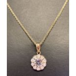A 9ct gold aquamarine and diamond pendant on a 20 inch fine chain, by Luke Stockley, London.