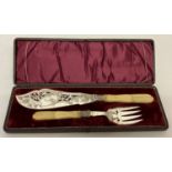 Antique silver plated fish servers with carved bone handles.