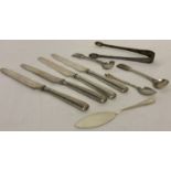 A small collection of vintage hallmarked cutlery items to include 4 silver handled butter knives.