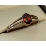 A 9ct gold garnet set dress ring.