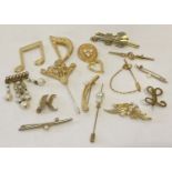 16 vintage and modern gold tone brooches and scarf clips in varying designs.