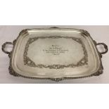 A very large late 19th century silver plated 2 handled tray with engraved detail.