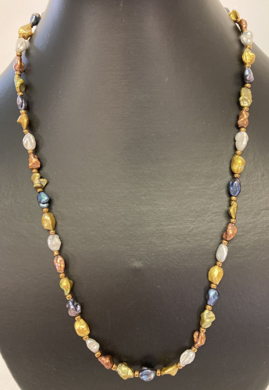 A 20" multicoloured freshwater pearl necklace with gold tone magnetic clasp.