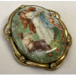 A large vintage pinchbeck mount brooch set with a ceramic panel depicting a courting couple.