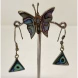 A Mexican silver butterfly brooch together with a pair of drop earrings, both set with paua shell.