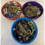 3 tubs of vintage and modern costume jewellery and beads.