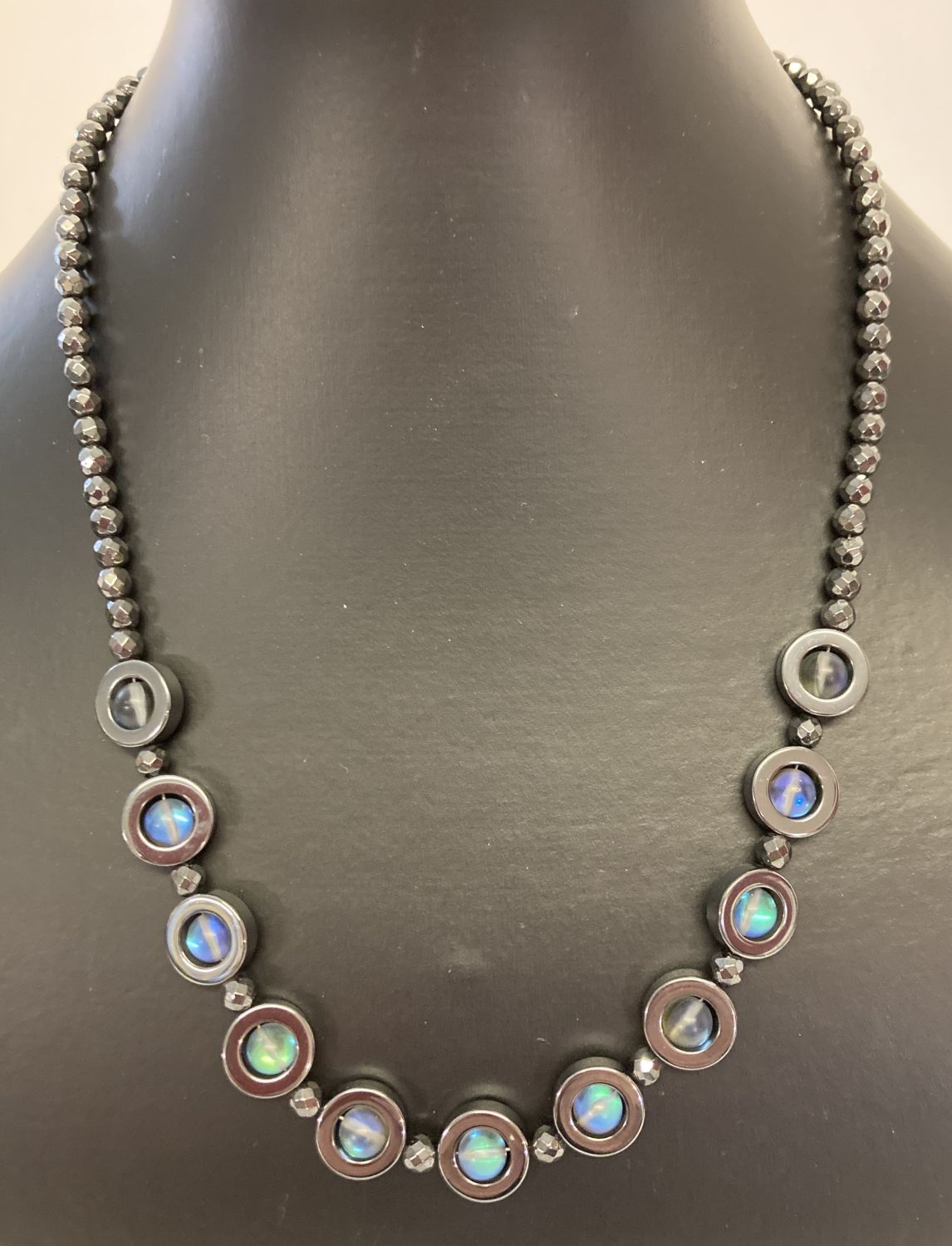 A hematite and Austrian crystal beaded 19" necklace with silver tone magnetic barrel clasp.