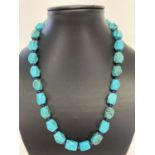 A 20" faceted turquoise beaded necklace with alternating small amethyst beads.