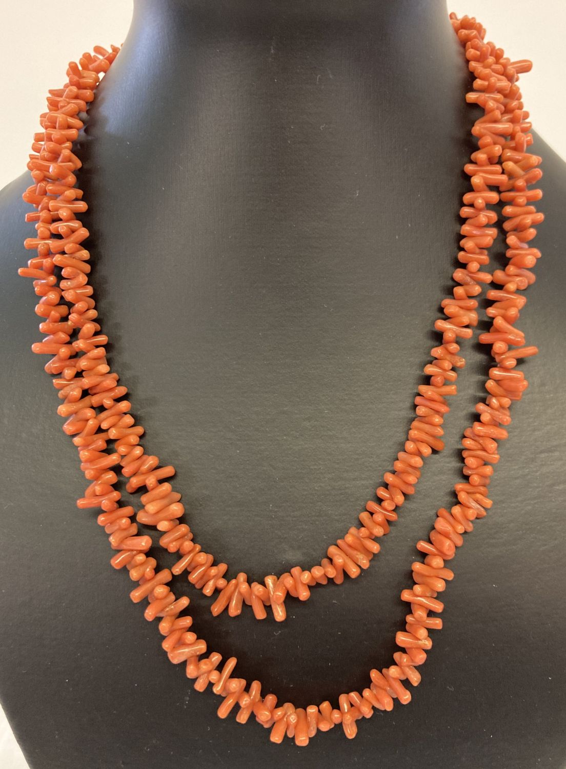A vintage 40 inch branch coral necklace with push barrel clasp.