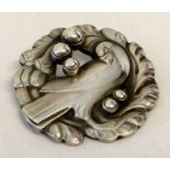 A vintage Georg Jensen silver bird brooch #165 with "silver pearl" detail.