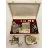 A vintage cream and gold jewellery box and contents.