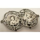 An antique silver Art Nouveau belt buckle, hallmarked B'ham 1900, with pierced work detail.