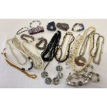 A tray of natural stone, shell and glass jewellery, to include jade, amethyst, amber and sodalite.