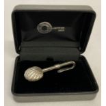 A boxed Collection 2000, 925 silver napkin hook with shell shaped clip.