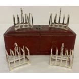 A cased set of 4 silver toast racks from Edwards Silversmiths & Jewellers, 92 Buchanan St, Glasgow.