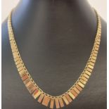 A 17 inch Cleopatra style 9ct gold necklace.