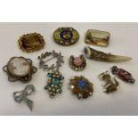 12 vintage brooches to include silver and stone set. Examples from Sphinx and Hollywood.