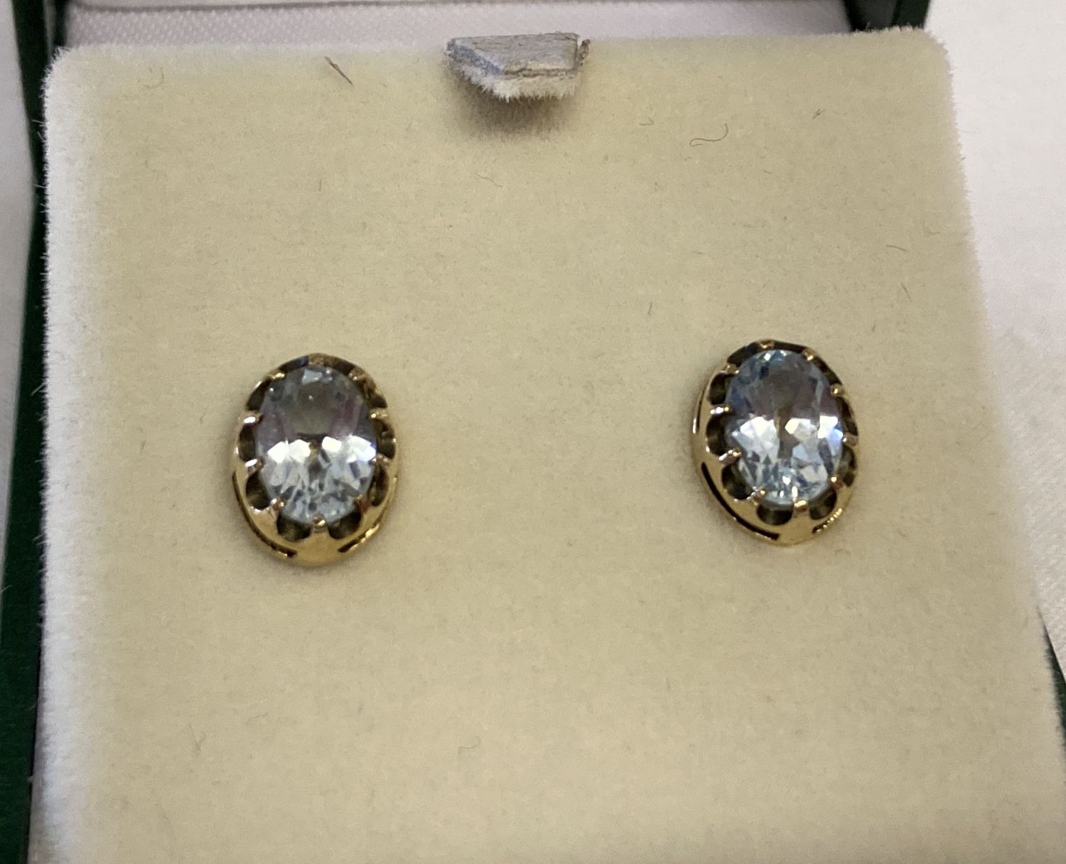 A pair of 9ct gold and blue topaz stud earring.