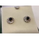 A pair of 9ct gold Onyx and diamond set stud earrings, by Luke Stockley, London.