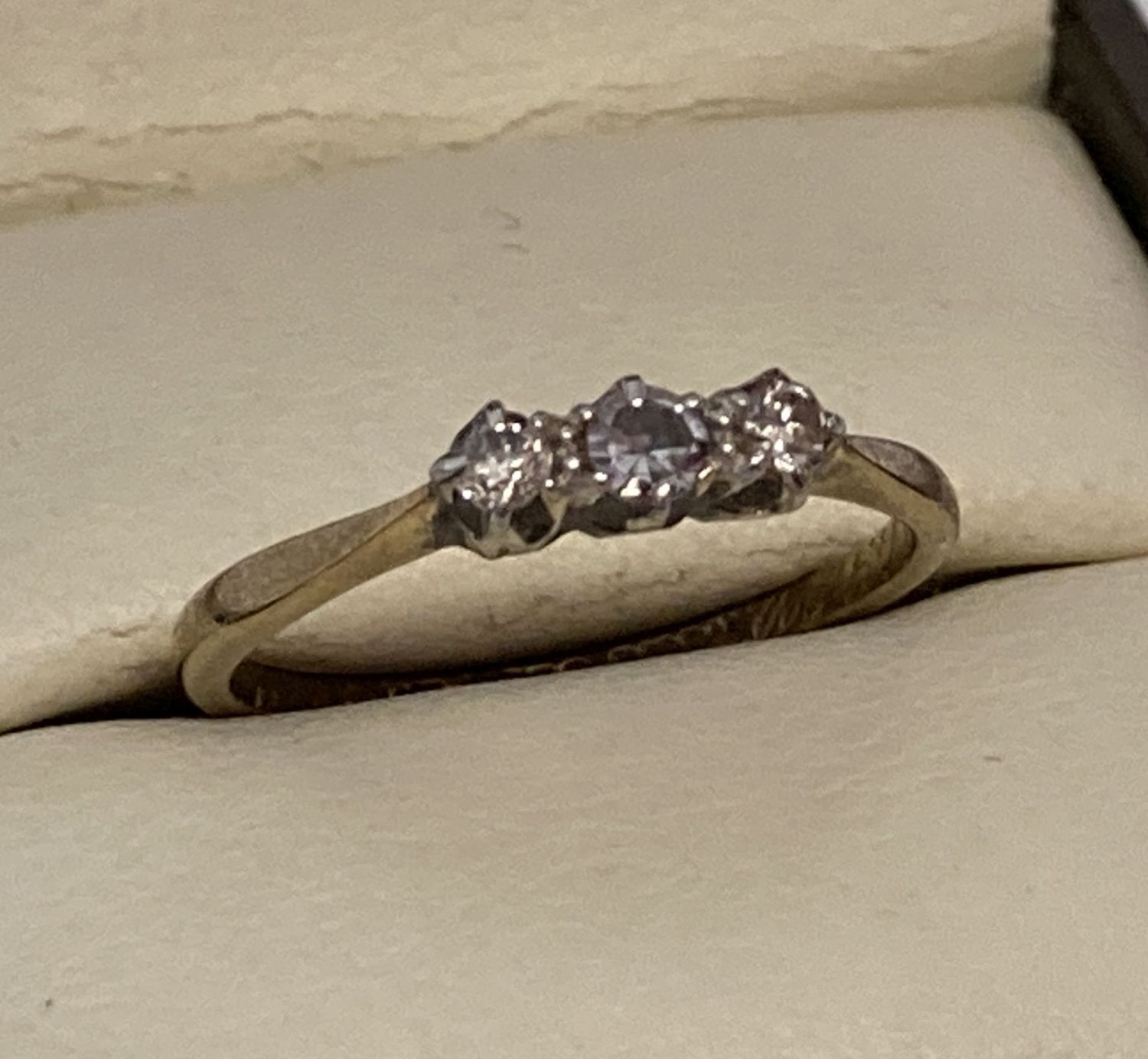 A vintage 9ct gold and platinum trilogy diamond ring.
