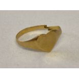 A 22ct scrap gold heart shaped signet ring, cut through.