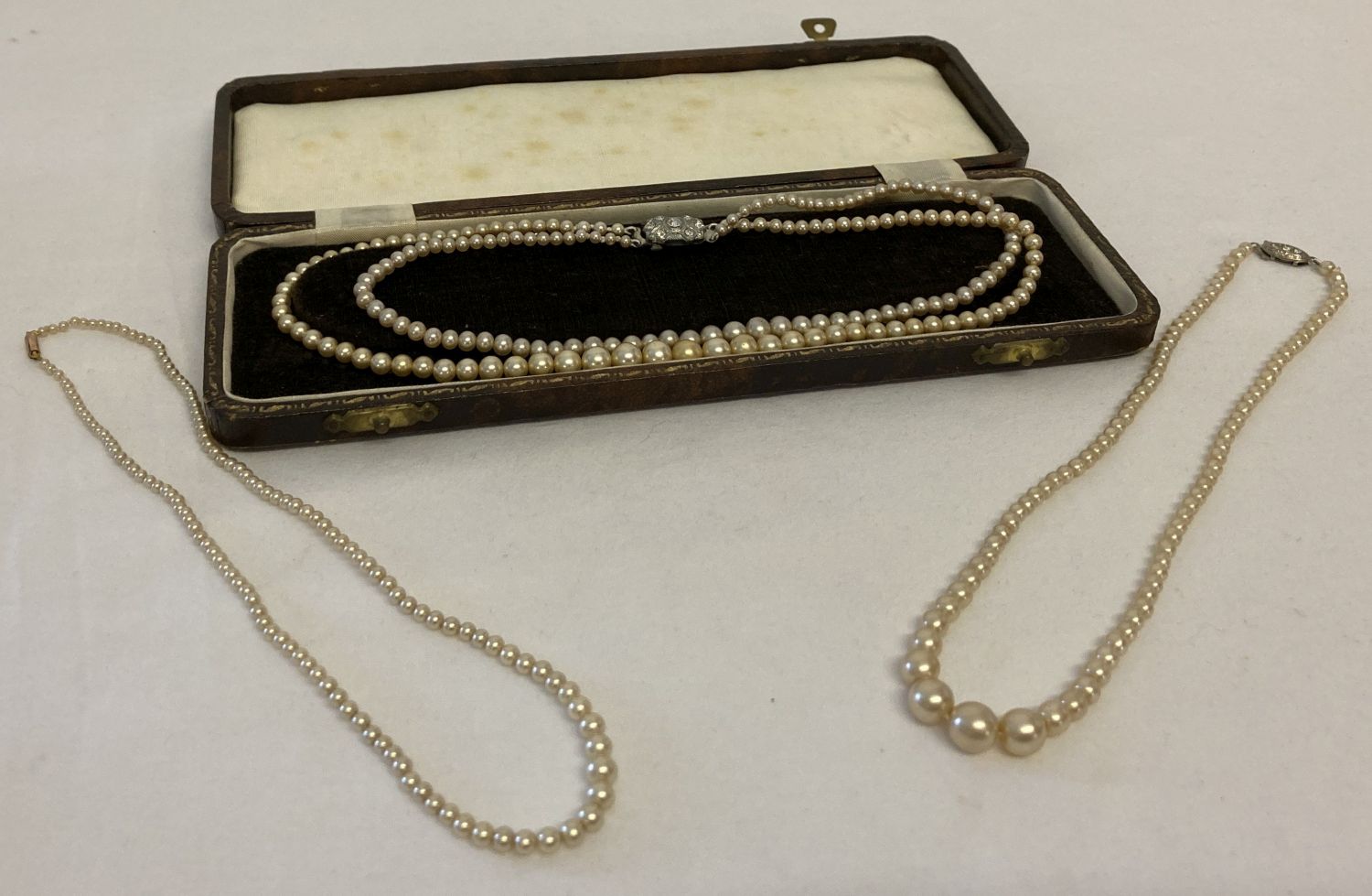 3 vintage faux pearl necklaces with a vintage necklace box. One with 9ct gold push barrel clasp.