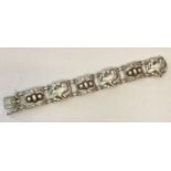 A vintage Georg Jensen silver 6 link bracelet with dove & foliage motifs and "silver pearl" detail.
