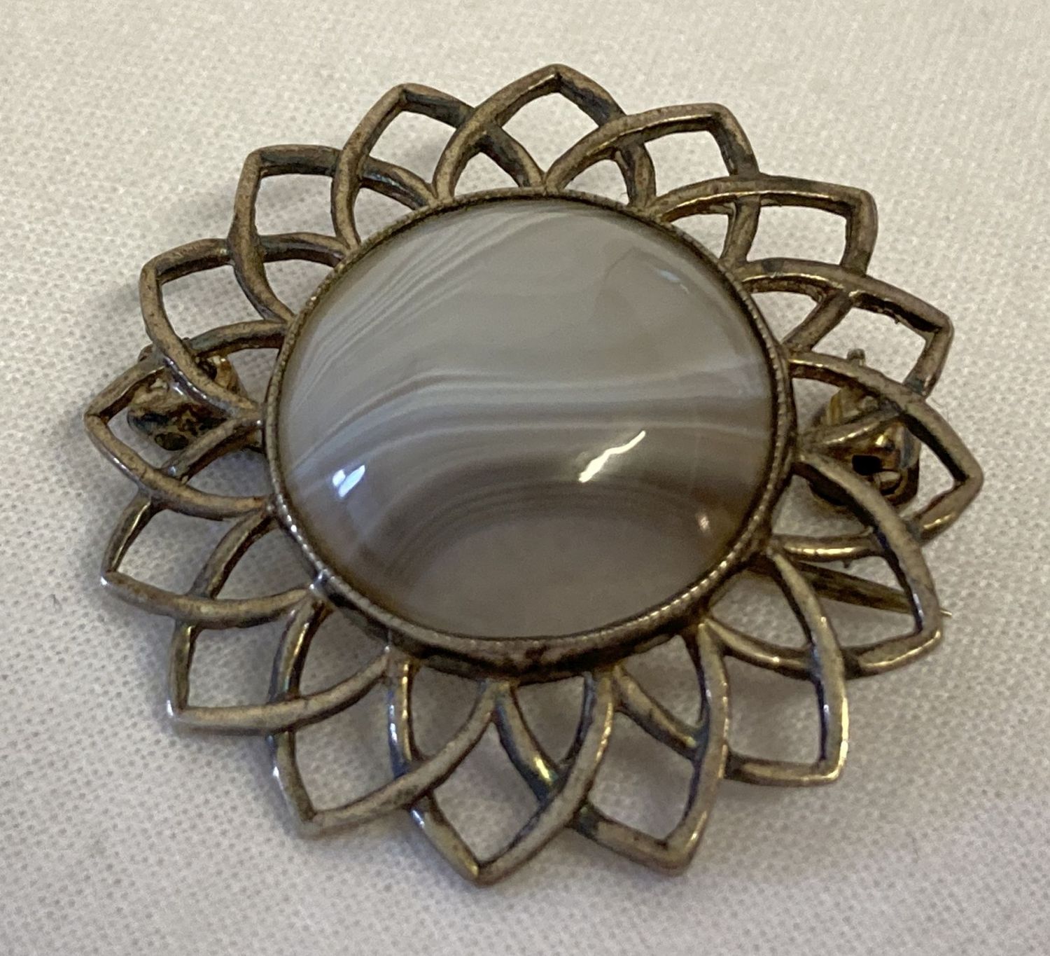 A vintage silver Iona brooch in flower design, set with central white and grey natural agate.