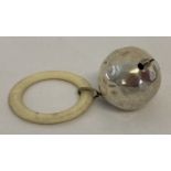 A vintage silver babies rattle bell with teething ring.