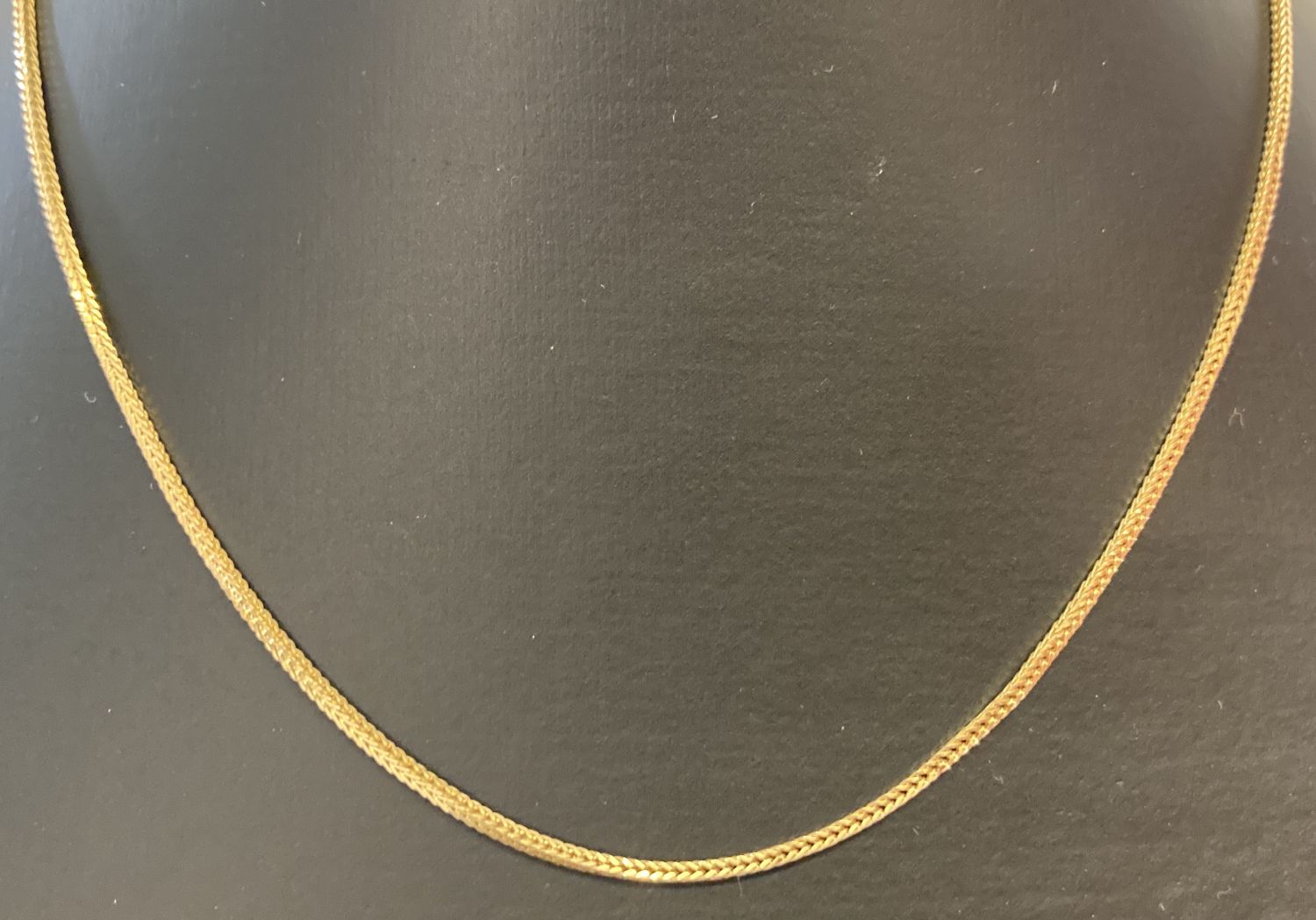 A 9ct gold foxtail chain with spring clasp, approx. 15 inches long.