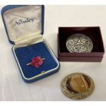 3 vintage brooches. A boxed large circular brooch with Celtic design by St. Justin.