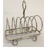 A vintage silver plated toast rack with serpent detail handle and feet.