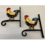 2 wall hanging basket sconces with painted cockerel motif.